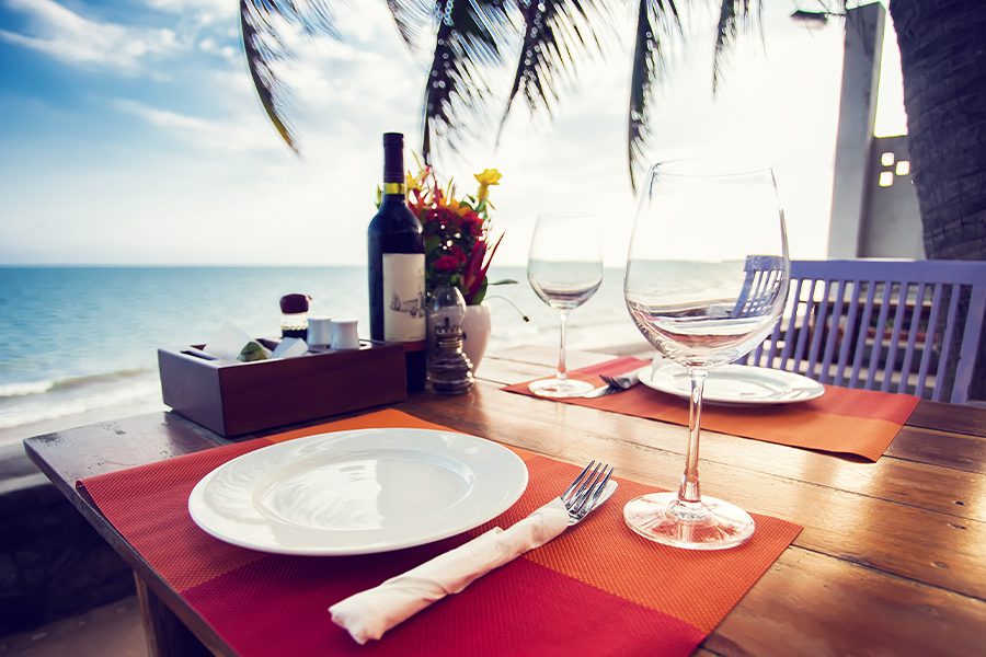 Specialized Business Insurance - Table Setting at a Small Beachfront Restaurant in the Summer at Sunset